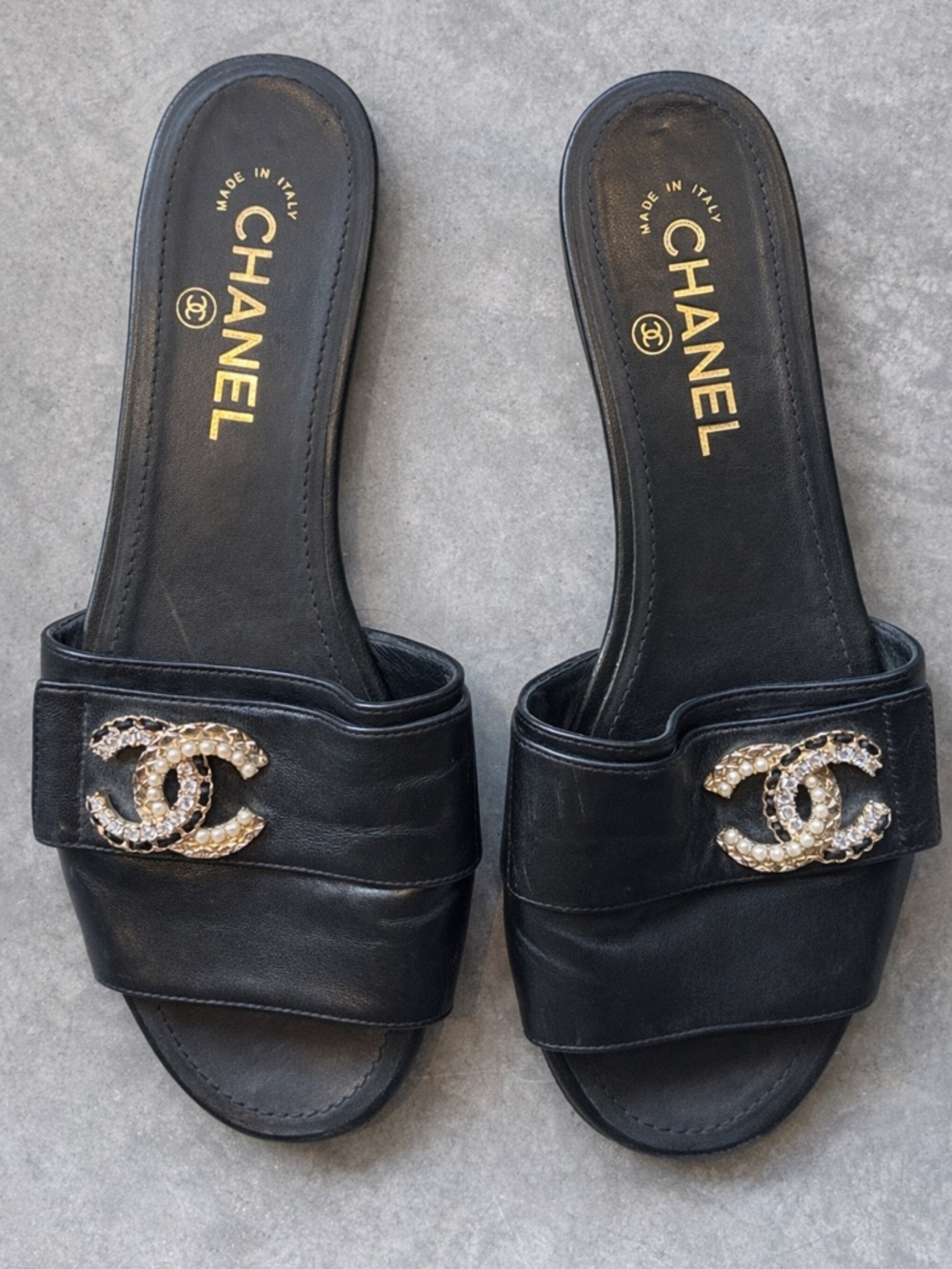 CHANEL Black Leather Slide Mules with Crystal & Gold CC Emblem